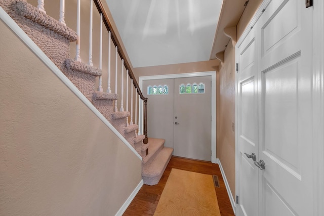 8750 20th Ave, Remus, MI 49340 - foyer with baseboards, wood finished floors, and stairway