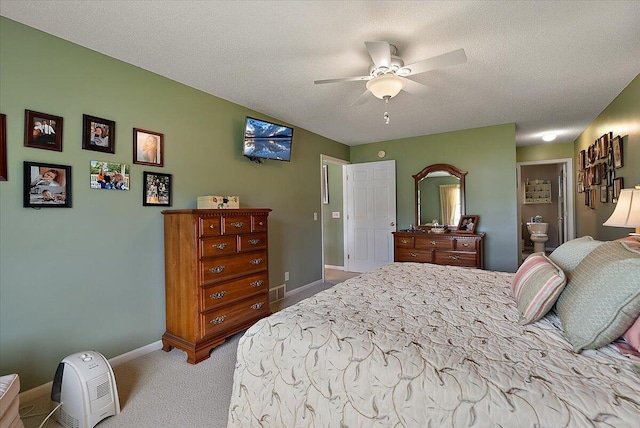 3799 Fairway Dr, Norton Shores, MI 49441 - bedroom with carpet, baseboards, ceiling fan, and ensuite bathroom