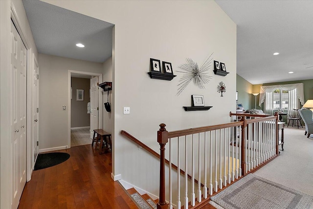 3799 Fairway Dr, Norton Shores, MI 49441 - hall featuring an upstairs landing, baseboards, hardwood / wood-style flooring, and recessed lighting