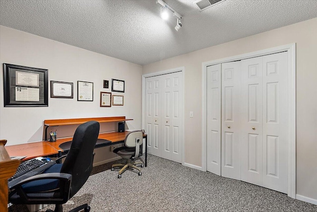 3799 Fairway Dr, Norton Shores, MI 49441 - home office featuring a textured ceiling, baseboards, and carpet flooring