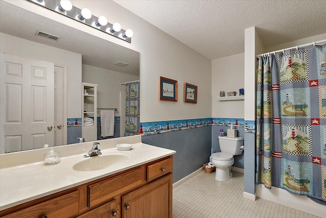 3799 Fairway Dr, Norton Shores, MI 49441 - full bathroom featuring vanity, toilet, a textured ceiling, tile patterned flooring, and a shower with shower curtain