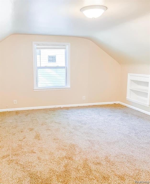 18220 Stout St, Detroit, MI 48219 - additional living space featuring lofted ceiling, carpet floors, baseboards, and built in features