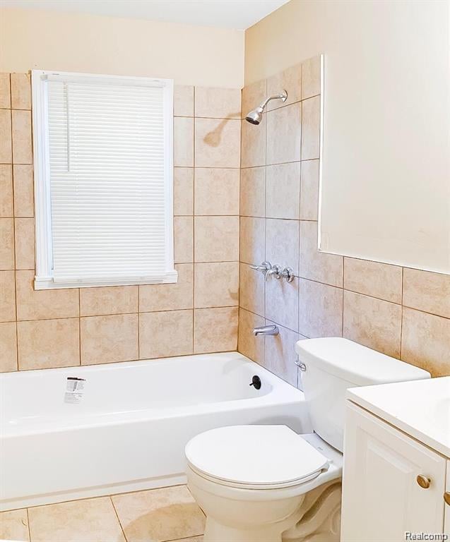 18220 Stout St, Detroit, MI 48219 - full bath featuring tile walls, vanity, toilet,  shower combination, and tile patterned floors