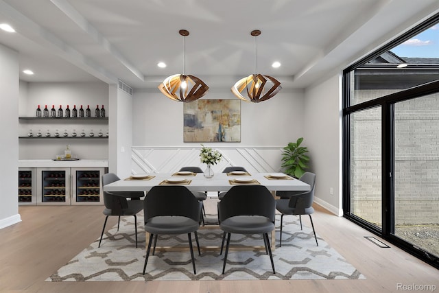 1792 Vista Dr, Oakland, MI 48363 - dining space with wood finished floors, baseboards, recessed lighting, a raised ceiling, and floor to ceiling windows