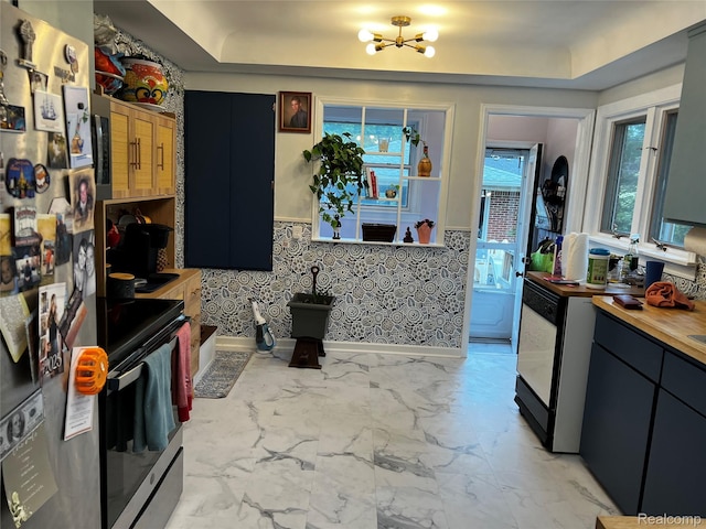3125 Syckelmoore St, Trenton, MI 48183 - kitchen featuring freestanding refrigerator, stainless steel range with electric cooktop, a chandelier, wooden counters, and a raised ceiling