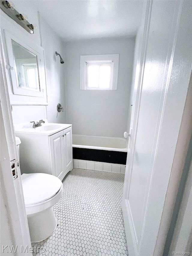 15307 Biltmore St, Detroit, MI 48227 - full bathroom featuring toilet, vanity, tile patterned flooring, and shower / bathtub combination