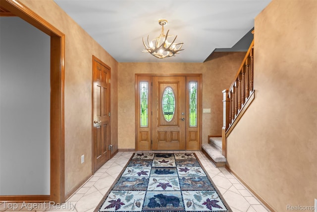 7386 Card Rd, Smiths Creek, MI 48074 - foyer entrance featuring a chandelier, stairway, and baseboards