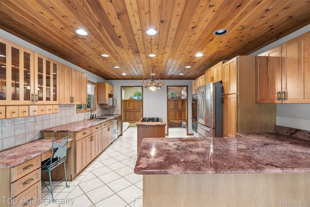 7386 Card Rd, Smiths Creek, MI 48074 - kitchen with stainless steel appliances, recessed lighting, light tile patterned flooring, a center island, and light stone countertops