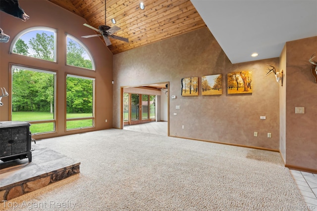 7386 Card Rd, Smiths Creek, MI 48074 - living room featuring a wood stove, high vaulted ceiling, plenty of natural light, wood ceiling, and ceiling fan
