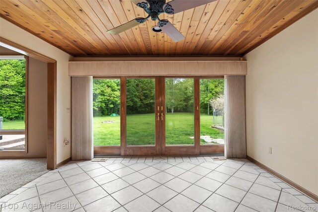 7386 Card Rd, Smiths Creek, MI 48074 - spare room with wooden ceiling, a ceiling fan, light tile patterned floors, and baseboards