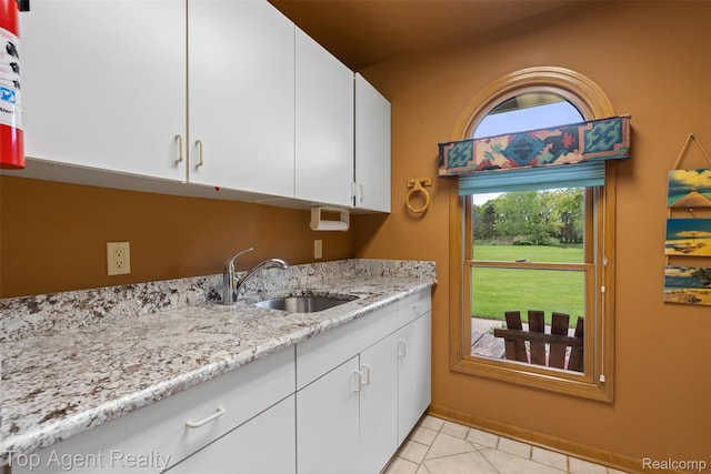 7386 Card Rd, Smiths Creek, MI 48074 - laundry area with cabinet space and light tile patterned flooring