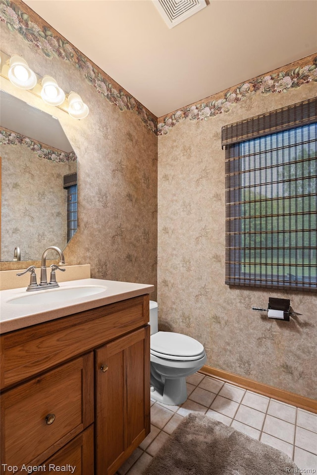 7386 Card Rd, Smiths Creek, MI 48074 - bathroom with vanity, tile patterned floors, toilet, and baseboards