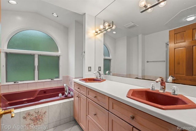 7386 Card Rd, Smiths Creek, MI 48074 - bathroom with double vanity, a whirlpool tub, recessed lighting, and tile patterned floors