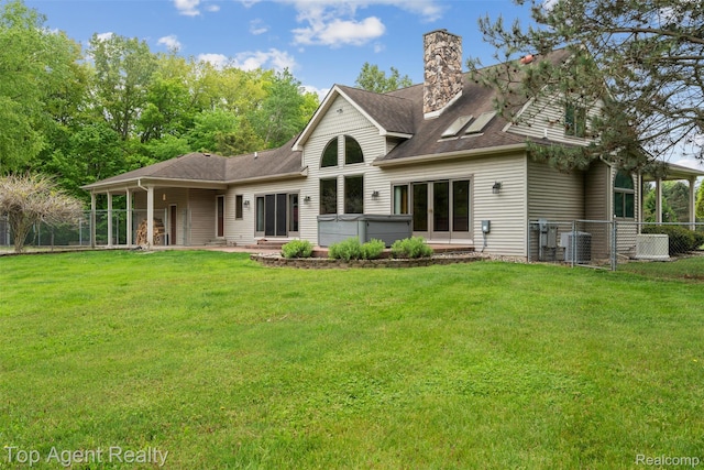 7386 Card Rd, Smiths Creek, MI 48074 - back of property featuring a hot tub, french doors, a chimney, central AC unit, and a shingled roof