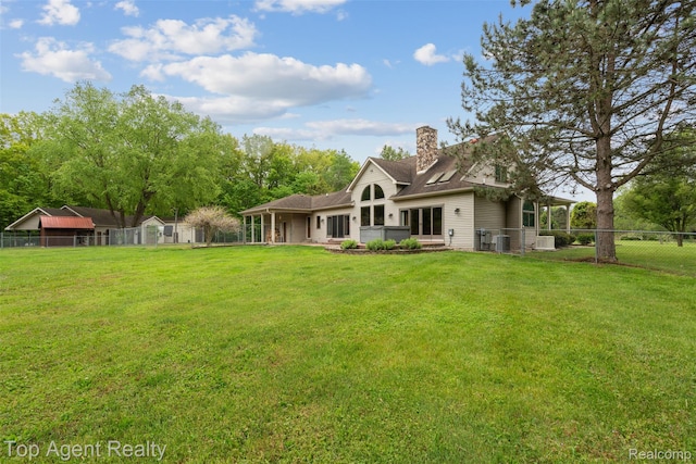 7386 Card Rd, Smiths Creek, MI 48074 - back of house featuring a chimney, central AC unit, and a shingled roof