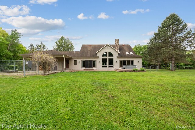7386 Card Rd, Smiths Creek, MI 48074 - rear view of house with a chimney and a patio
