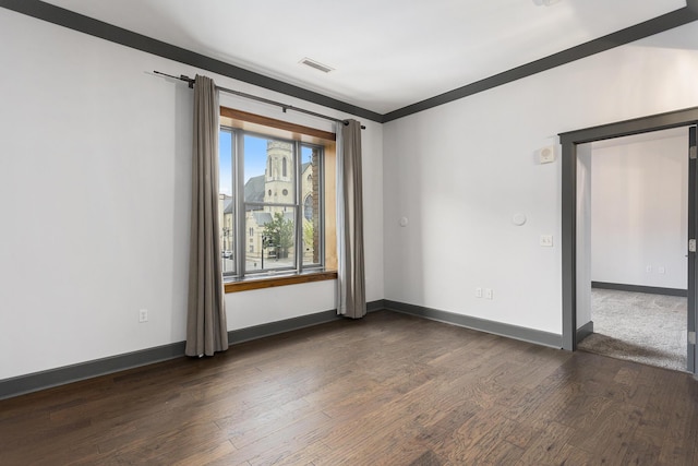 27 Library St NE Unit 301, Grand Rapids, MI 49503 - unfurnished room featuring dark wood-type flooring and baseboards