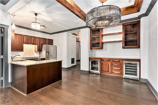 27 Library St NE Unit 301, Grand Rapids, MI 49503 - kitchen with beverage cooler, stainless steel fridge, a sink, and dark wood-type flooring