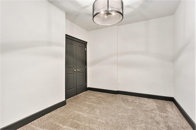 27 Library St NE Unit 301, Grand Rapids, MI 49503 - unfurnished room featuring carpet and baseboards