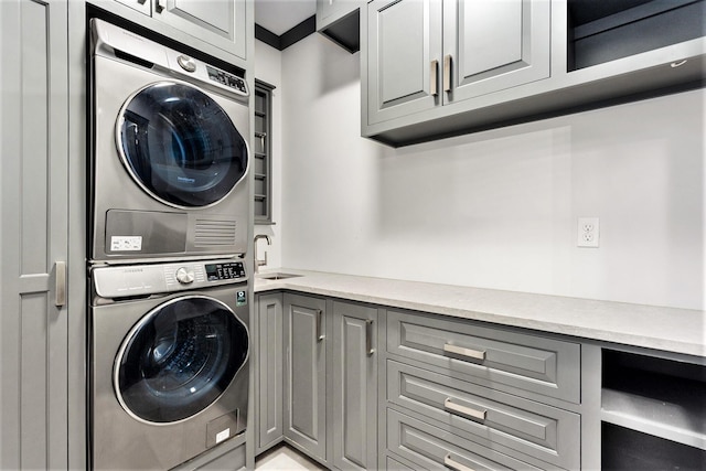 27 Library St NE Unit 301, Grand Rapids, MI 49503 - laundry area with estacked washer and dryer and cabinet space