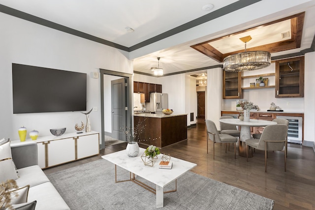 27 Library St NE Unit 301, Grand Rapids, MI 49503 - living room with beverage cooler, a chandelier, dark wood-style floors, and a raised ceiling