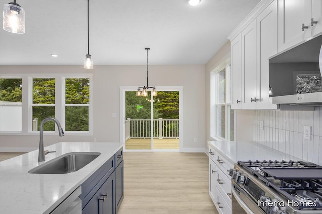 3341 Kings River St SW Unit 40, Wyoming, MI 49418 - kitchen featuring appliances with stainless steel finishes, a sink, white cabinetry, recessed lighting, and pendant lighting