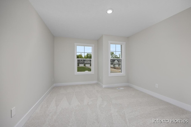 3341 Kings River St SW Unit 40, Wyoming, MI 49418 - empty room featuring baseboards and light carpet