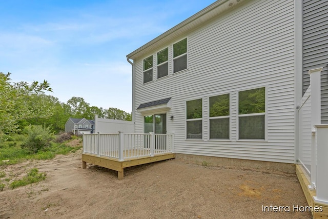 3341 Kings River St SW Unit 40, Wyoming, MI 49418 - rear view of house with a wooden deck