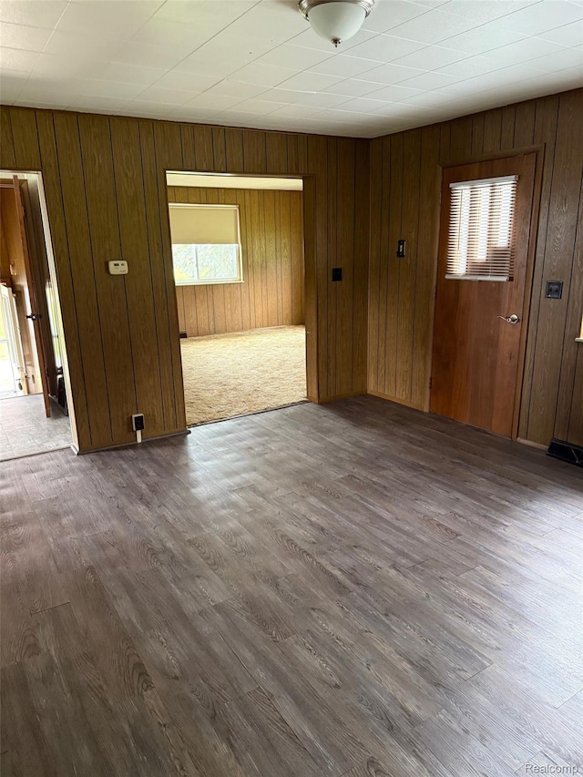 6600 Jefferson Rd, North Branch, MI 48461 - spare room with dark wood-style floors and wooden walls