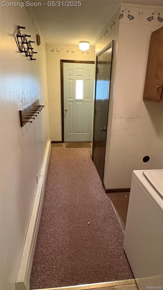 8865 E Bennington Rd, Durand, MI 48429 - corridor featuring washer / dryer, baseboards, and carpet flooring