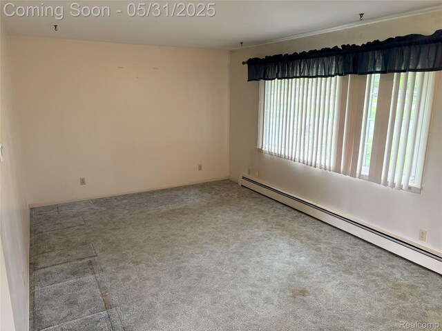 8865 E Bennington Rd, Durand, MI 48429 - carpeted spare room with baseboard heating