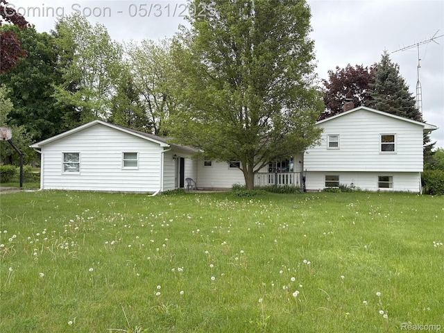 8865 E Bennington Rd, Durand, MI 48429 - rear view of house featuring a lawn