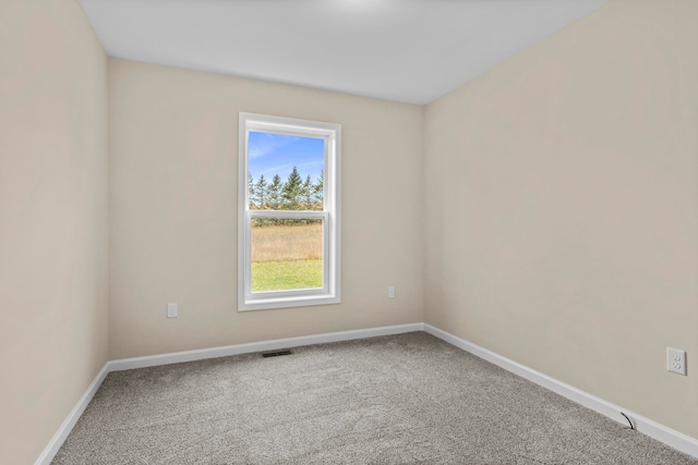 8524 S Elizabeth Dr, Maple City, MI 49664 - carpeted spare room with baseboards