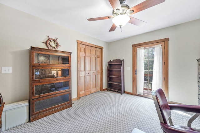 3958 Northshore Trl, Kewadin, MI 49648 - office area featuring light carpet, baseboards, and ceiling fan