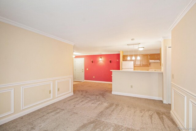 15200 Silver Pkwy Unit 101, Fenton, MI 48430 - unfurnished living room featuring crown molding, light carpet, a wainscoted wall, and a decorative wall