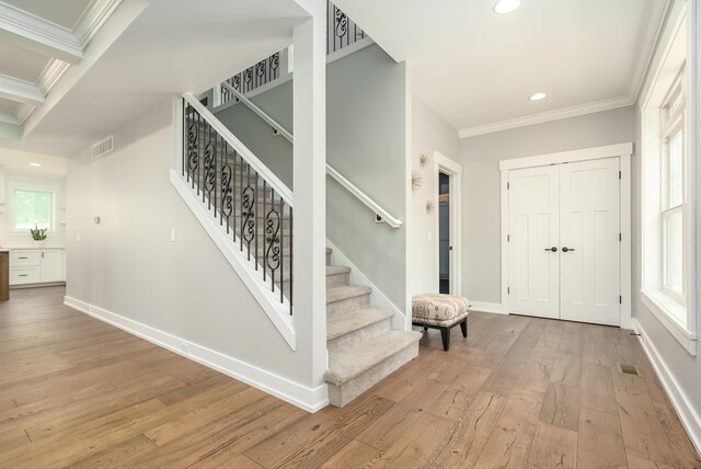 6606 Spaniel Dr, Kalamazoo, MI 49009 - entryway featuring ornamental molding, hardwood / wood-style flooring, recessed lighting, stairway, and baseboards