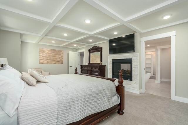 6606 Spaniel Dr, Kalamazoo, MI 49009 - bedroom featuring coffered ceiling, recessed lighting, baseboards, a glass covered fireplace, and light carpet