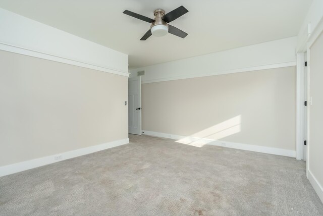 6606 Spaniel Dr, Kalamazoo, MI 49009 - spare room featuring ceiling fan, light carpet, and baseboards
