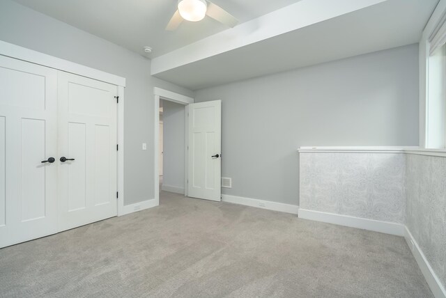 6606 Spaniel Dr, Kalamazoo, MI 49009 - unfurnished bedroom with carpet floors, a ceiling fan, a closet, and baseboards