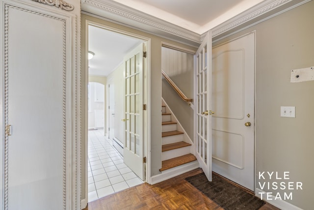 600 Plymouth Ave SE, East Grand Rapids, MI 49506 - foyer featuring stairway, ornamental molding, and a baseboard heating unit