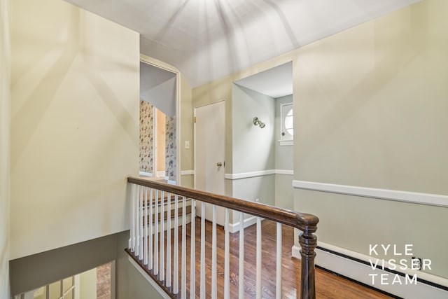 600 Plymouth Ave SE, East Grand Rapids, MI 49506 - staircase featuring wood finished floors and a baseboard heating unit