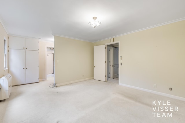 600 Plymouth Ave SE, East Grand Rapids, MI 49506 - unfurnished bedroom featuring ornamental molding, light carpet, and baseboards