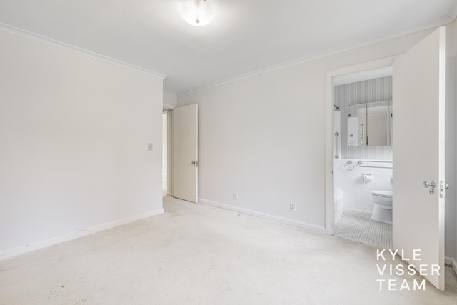 600 Plymouth Ave SE, East Grand Rapids, MI 49506 - unfurnished bedroom with ornamental molding, connected bathroom, carpet floors, and baseboards