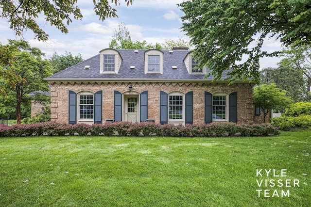 600 Plymouth Ave SE, East Grand Rapids, MI 49506 - view of front of property with a front lawn, roof with shingles, and brick siding