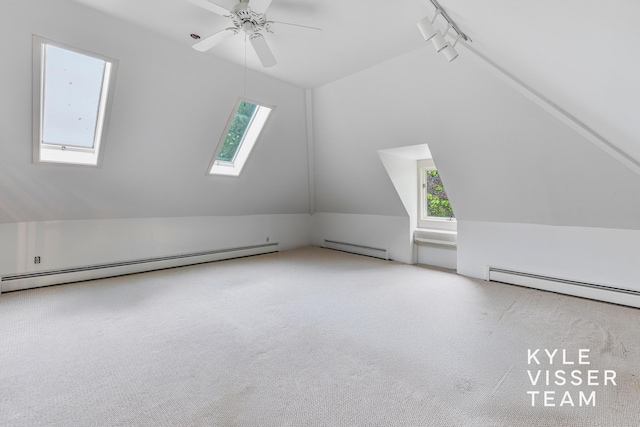 600 Plymouth Ave SE, East Grand Rapids, MI 49506 - bonus room with vaulted ceiling, a skylight, baseboard heating, carpet, and a ceiling fan