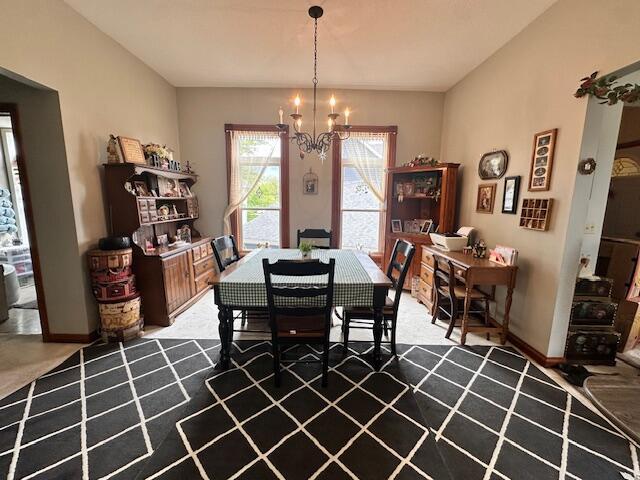 6 Vine St, Hillsdale, MI 49242 - dining area with a chandelier and baseboards
