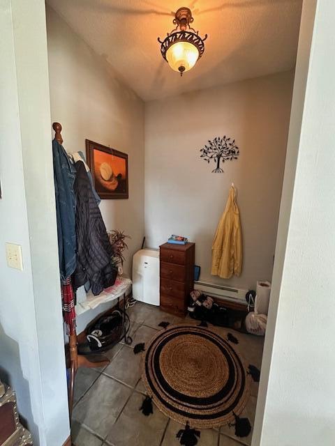 6 Vine St, Hillsdale, MI 49242 - mudroom featuring tile patterned flooring and a baseboard radiator
