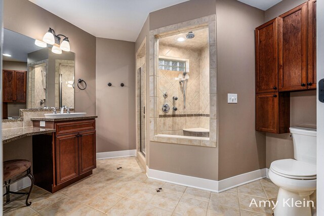 1657 N Bay Dr, Hudsonville, MI 49426 - full bathroom with baseboards, a stall shower, tile patterned flooring, toilet, and vanity