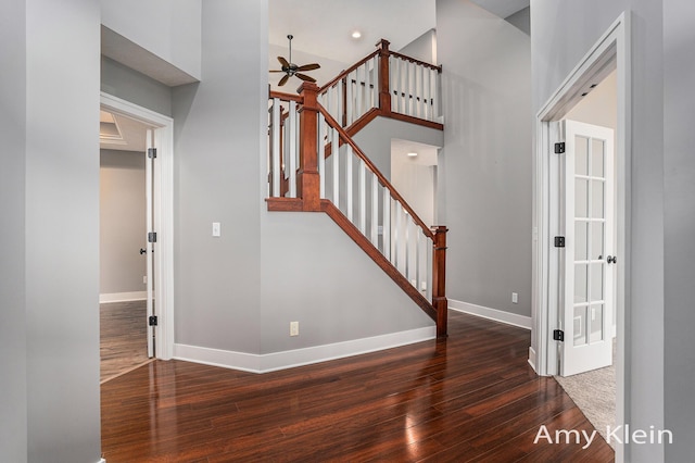 1657 N Bay Dr, Hudsonville, MI 49426 - staircase with hardwood / wood-style flooring, baseboards, and ceiling fan