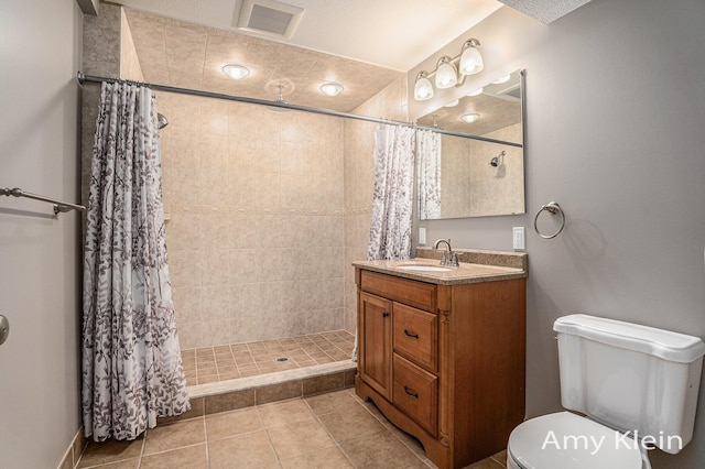 1657 N Bay Dr, Hudsonville, MI 49426 - full bathroom featuring vanity, a tile shower, toilet, and tile patterned floors